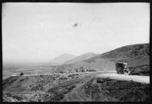 Hilly landscape showing military trucks, north of Larissa, near Ellason, Greece, during World War II - Photograph taken by Ian Macphail