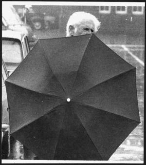 Pedestrian holding umbrella, Wellington