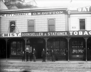View of the business of the City Pharmacy and G W Dutton, Lambton Quay, Wellington