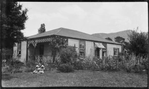 Children in garden of house, Mangamahu