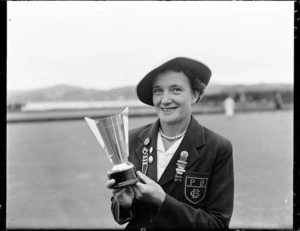 Mrs E Young, bowls champion, with trophy