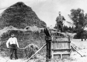 Creator unknown : Photograph of men making hay bales with a hand press