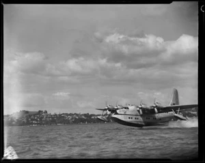 Tasman Empire Airways Ltd, Solent IV flying boat, RMA Aranui, ZK-AMO, lifting off the water, Mechanics Bay, Auckland