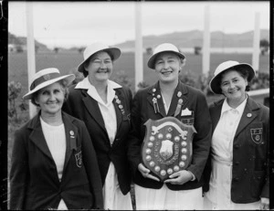 Four women with bowls trophy