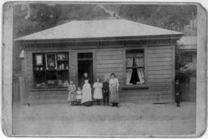 W Farrell & Co :Kearney family, in front of their shop on Glenmore Street, Thorndon, Wellington