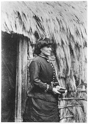 Sophia Hinerangi by whare doorway at Whakarewarewa