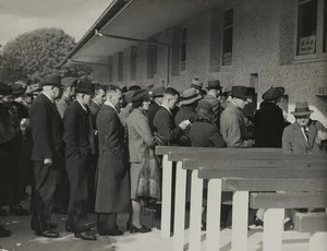 Racegoers lining up to collect winnings at the tote