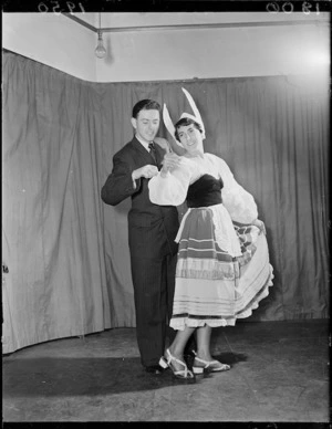 Man and woman in costumes for The Merry Widow
