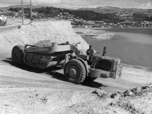 Earthmoving machinery being used to form an area by Wellington Airport at Rongotai