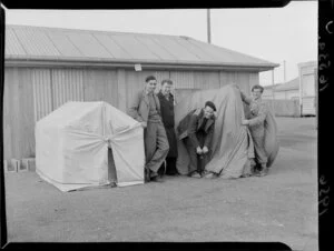 Jack Everson, Bruce Shearer, George Dolden and Bill O'Keefe, the first spectators to arrive at Athletic Park, Wellington, for the Springboks versus All Blacks second test rugby match, with their tents