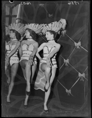 Pat Penrose, star of Peep Show (where she plays the Oomph Girl) with two unidentified girls; the three are in chorus girl costumes