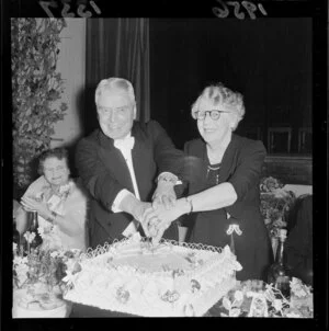 Golden wedding portrait of Mr & Mrs Walter Nash, cutting their cake