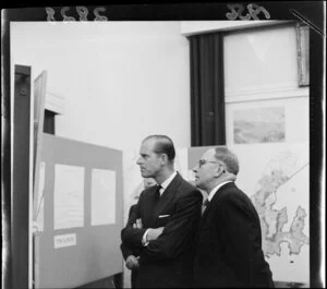 The Duke of Edinburgh looking at plans for Wellington during the 1956 royal visit