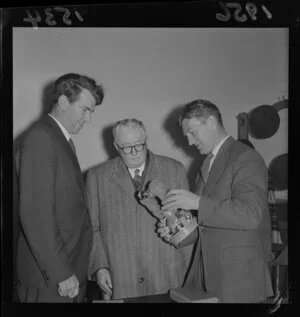 Sir Edmund Hillary, Sir William Appleton and J Holmes Miller holding a theodolite
