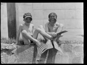 Two boys, Philip Vincent and Jan Woodward, wearing masks and flippers, Balena Bay, Wellington