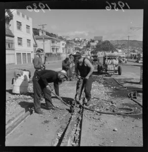 Unidentified group of workman removing tram rails, Oriental Bay, Wellington