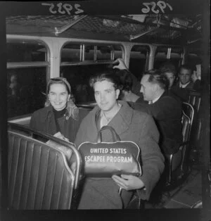 Young man and woman, in a bus with other Hungarian refugees, Wellington
