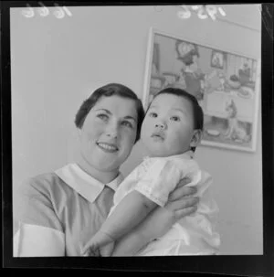 Joan Grantham, Karitane nurse, holding a Chinese baby