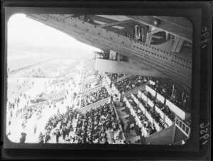 Spectators watching race in a grandstand, Kyoto, Japan, including structural beams