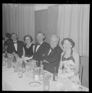 Leader of the opposition and the Labour Party, and soon to be Prime Minister, Walter Nash, who is sitting with the official party at the Hutt Valley A & P Society Ball, Taita Hall, Lower Hutt