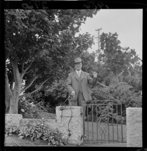 Mr C W Austin and the Christmas tree, damaged by vandals