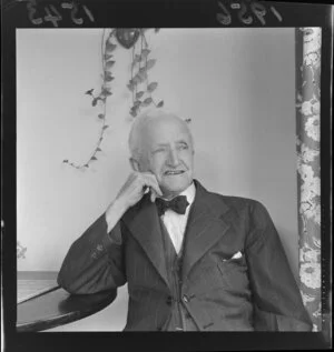 Portrait of Teddy Hill wearing a three piece suit with a bow tie