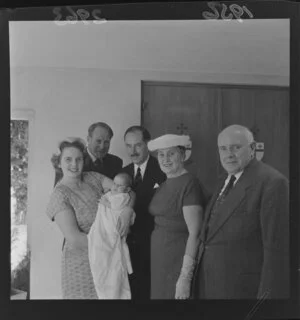 Small group at the christening of the baby son of Mr and Mrs F H Cockyer