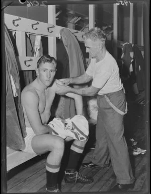 Unidentified 1956 Springbok rugby union football player undergoing physio on his arm