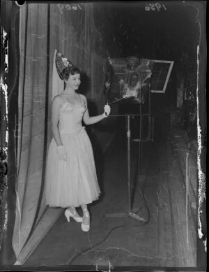 Dancer Pat Penrose, star of the Peep Show (the Oomph Girl), waits backstage in costume