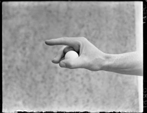 Cricketer's grip on a tennis ball