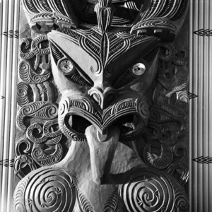 Traditional Maori wood carving on a meeting house at Te Kaha