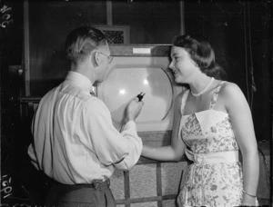 Mr D Barnett and Miss Wallace with a television
