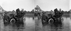 Model T Ford and passengers, in 2 feet of water