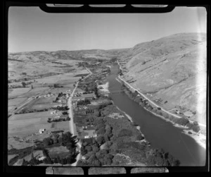 Millers Flat, Otago, includes bridge, township, housing, Clutha River and farmland