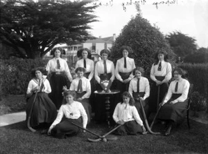 Group portrait of a young women's hockey team, Kaponga