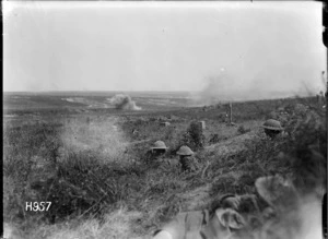 New Zealand troops in shell hole positions during shelling by German artillery in France, World War I