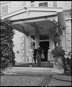 Her Majesty Queen Elizabeth II and Philip, Duke of Edinburgh, on the steps of Government House, Auckland - Photograph taken by E P Christensen