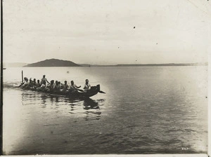 Creator unknown : Photograph of Maori men paddling in a waka on Lake Rotorua