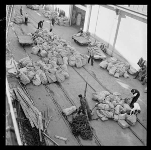 Unloading mailbags on the Wellington wharf