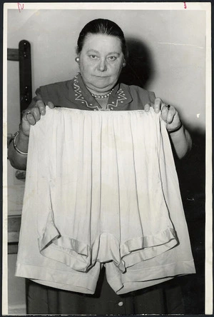 Member of Parliament, Mabel Howard, demonstrating that oversize bloomers vary in size