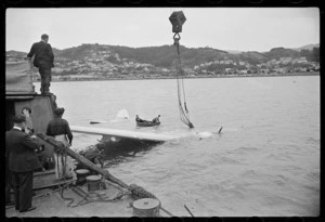 Raising a Royal New Zealand Air Force Catalina flying boat from the sea with wire cable, Evans Bay, Wellington