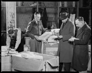 Customs Department employees checking parcels - Photograph taken by E P Christensen