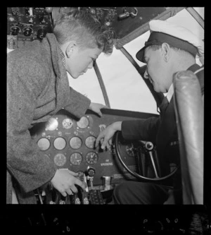 School boy talking to a pilot aboard the TEAL Solent flying boat Awatere