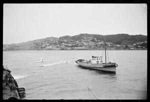 Men on floating crane watching raising of a Royal New Zealand Air Force Catalina flying boat, Evans Bay, Wellington