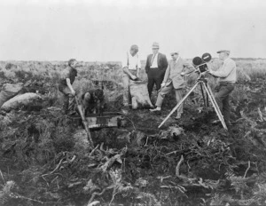 Men from the Fox film company of New York filming gum digging in Northland