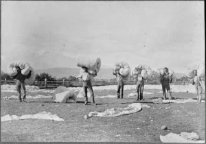 Men working with wool at Frank Stubbings' woolwash, Waiouru