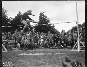 Athlete Mrs Tyler high jumping at Hataitai Park, Wellington