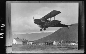 De Havilland Fox Moth aeroplane ZK ADI, flying over Haast aerodrome