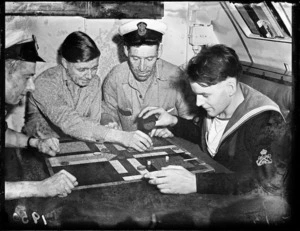 Four sailors from HMS Telemachus playing ukkers (ludo), Wellington