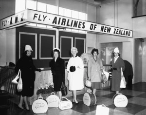 Women at Paraparaumu Airport, alongside the South Pacific Airlines of New Zealand counter